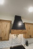 Custom Amish Kitchen Cabinetry, Rustic Maple in Husk Stain on Perimeter, Maple Painted Black on Hood