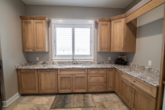 Laundry Room, Amish Cabinetry, Maple in Husk Finish, Granite Countertops in White Bahamas