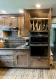 Amish Cabinetry, Cherry wood with a Pinecone stain. Viatera Nocturne quartz countertop. 
