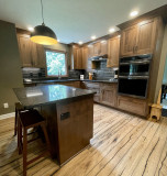  Amish Cabinetry, Cherry wood with a Pinecone stain. Viatera Nocturne quartz countertop.