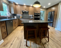  Amish Cabinetry, Cherry wood with a Pinecone stain. Viatera Nocturne quartz countertop.