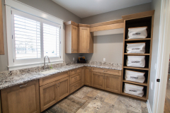 Laundry Room, Amish Cabinetry, Maple in Husk Finish, Granite Countertop in White Bahamas