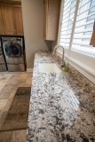 Laundry Room, Amish Cabinetry, Maple in Husk Finish, Granite Countertops in White Bahamas
