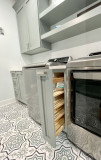 Amish cabinetry, painted Cornwall Blue, Quartz countertops 