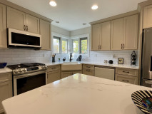 Amish Kitchen Cabinetry, Maple, Painted Pottery on Perimeter, Oak, Timberlake Stain on Island, Hanstone Calacatta Extra Quartz Countertop