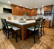 Waypoint, 470F Maple Cognac and Painted Sage, MSI Calacatta Viraldi Quartz